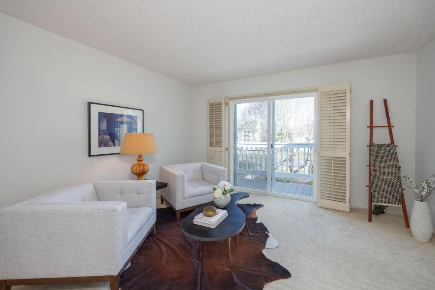 21 Pinehurst Lane Half Moon Bay, CA 94019 - Photo 27 of 43 a living room with furniture and a window