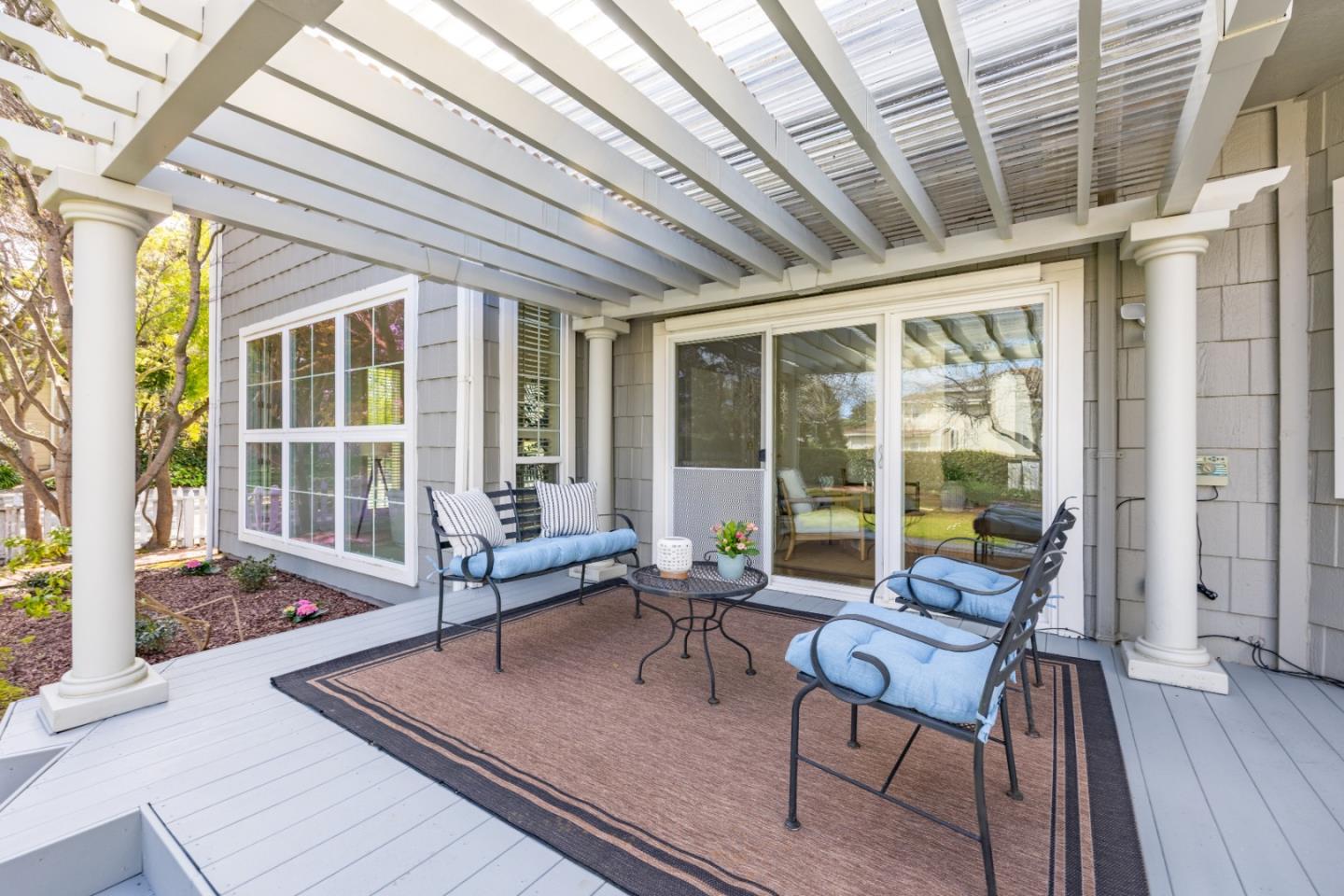 21 Pinehurst Lane Half Moon Bay, CA 94019 - Photo 32 of 43 a living room with furniture and floor to ceiling windows