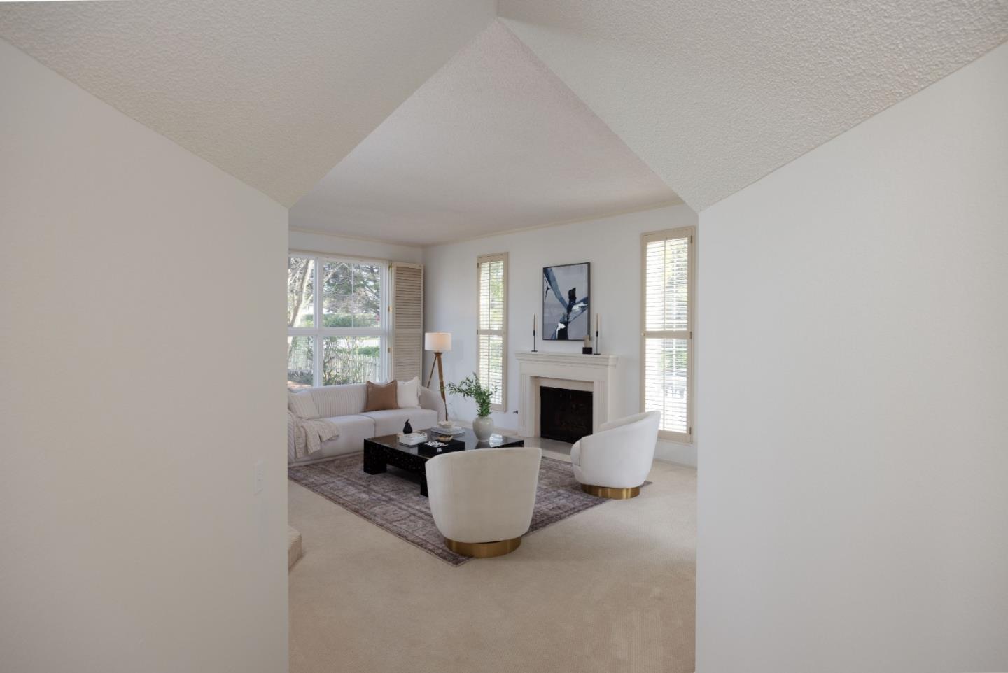 21 Pinehurst Lane Half Moon Bay, CA 94019 - Photo 4 of 43 a living room with furniture and a fireplace