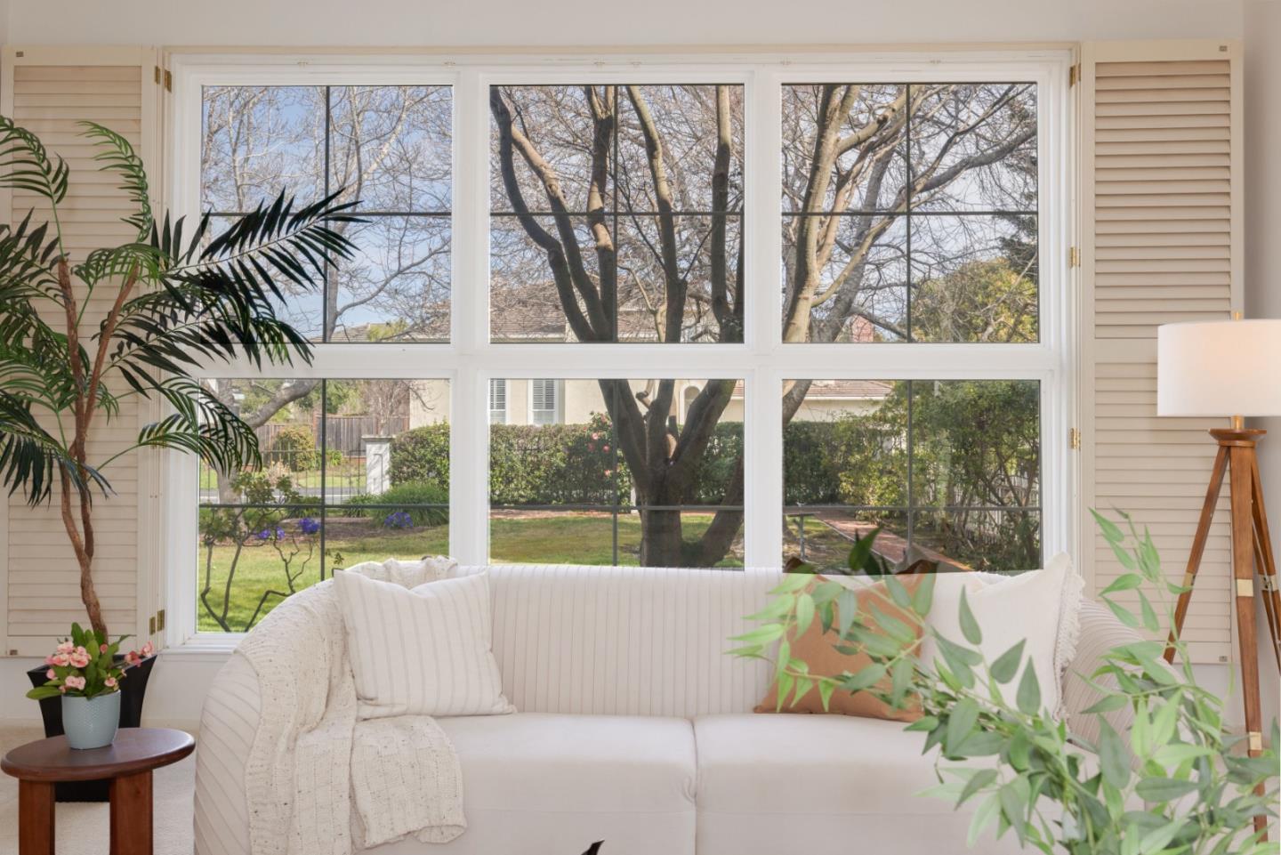 21 Pinehurst Lane Half Moon Bay, CA 94019 - Photo 8 of 43 a living room with large windows and a table
