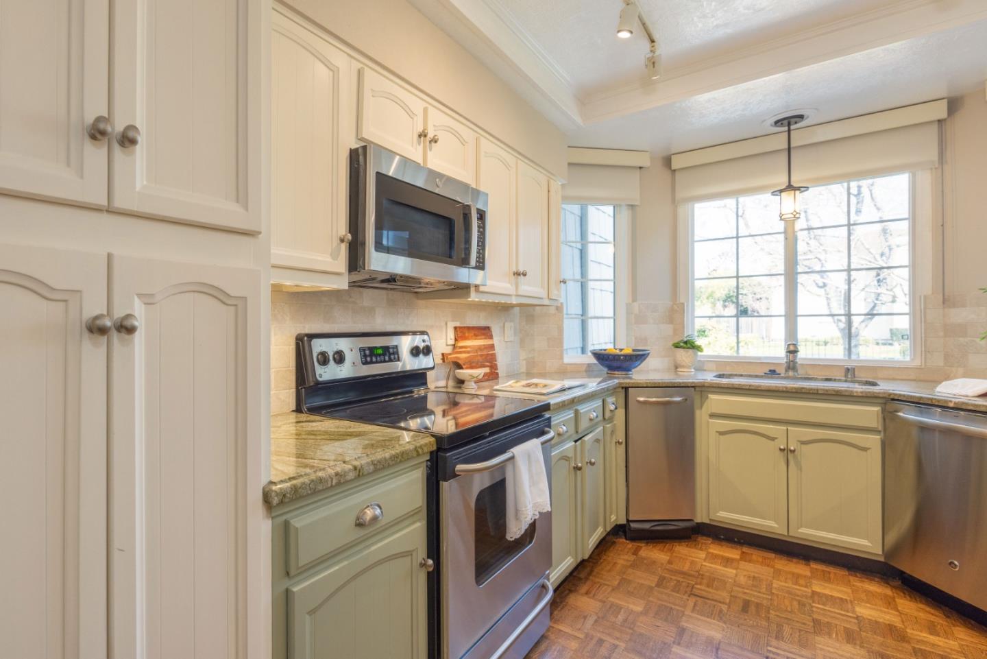 21 Pinehurst Lane Half Moon Bay, CA 94019 - Photo 9 of 43 a kitchen with a sink stove and microwave