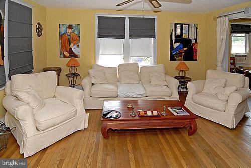 1700 Ednor Road Silver Spring, MD 20905 - Photo 16 of 18 a living room with furniture and a table