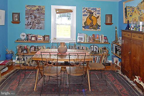 1700 Ednor Road Silver Spring, MD 20905 - Photo 5 of 18 a view of a dining room with furniture window and wooden floor