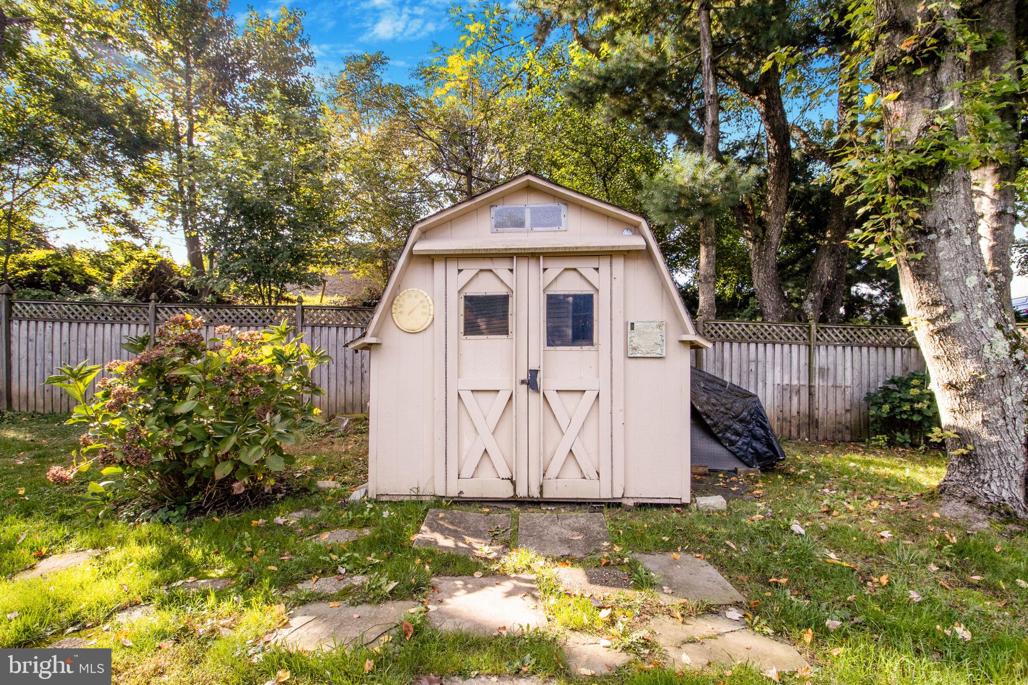 7316 Torran Rocks Way Gaithersburg, MD 20879 - Photo 10 of 17 a view of a tiny house with large trees