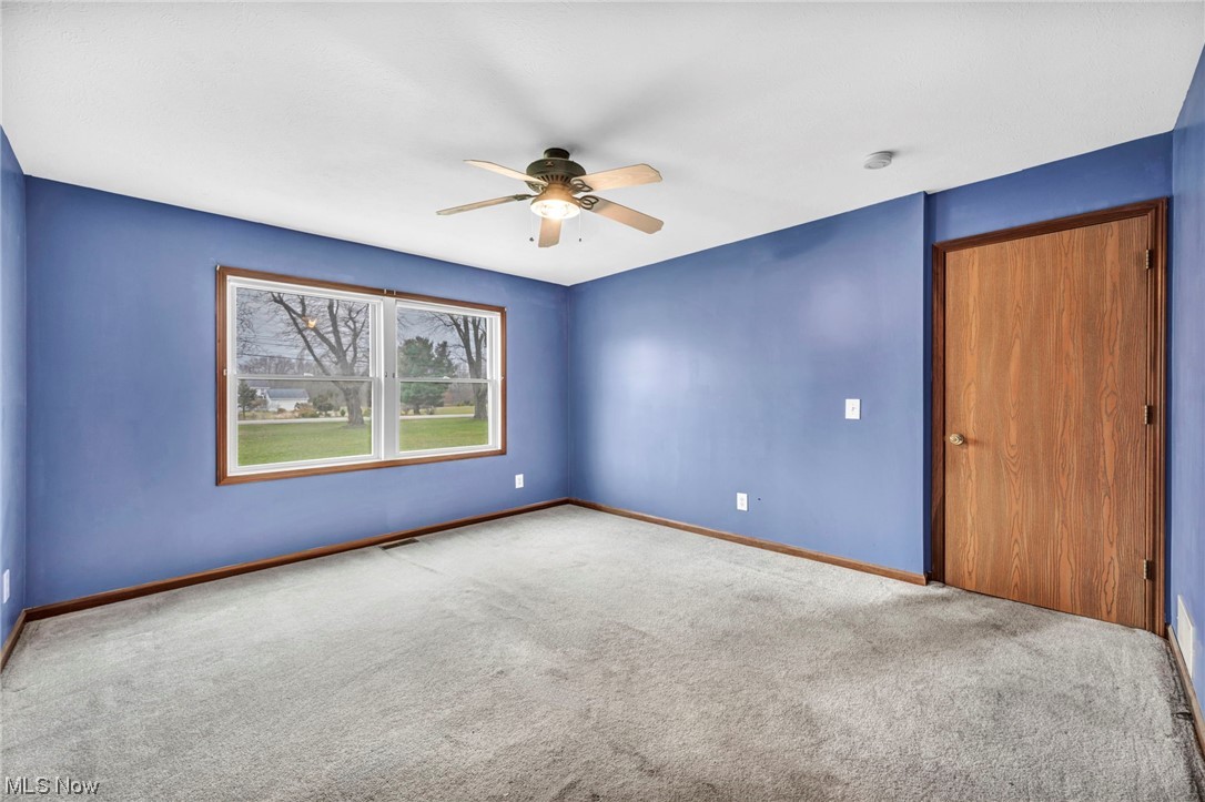 35808 Lorain Road North Ridgeville, OH 44039 - Photo 20 of 35 Spare room featuring light carpet and ceiling fan