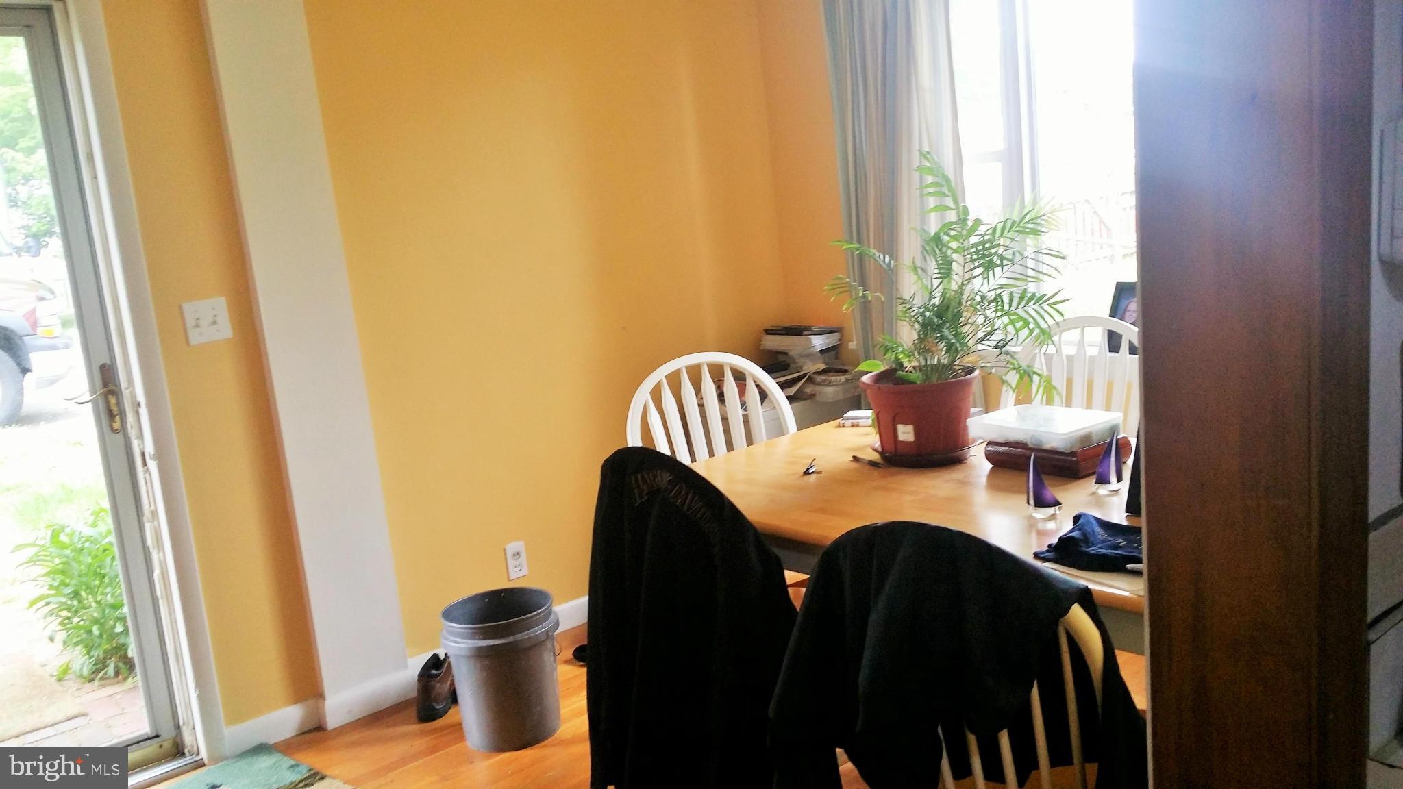 1607 Oldtown Road Edgewater, MD 21037 - Photo 2 of 11 a table and chair in a balcony