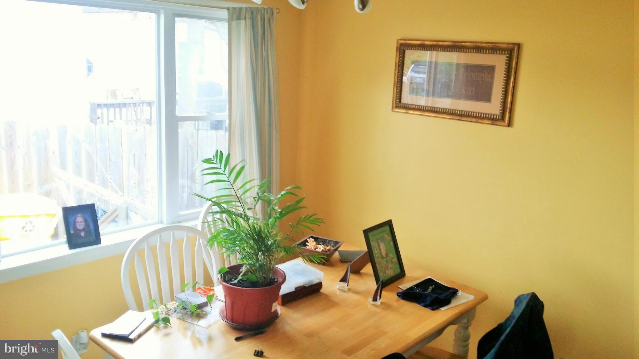 1607 Oldtown Road Edgewater, MD 21037 - Photo 4 of 11 a dining room with a table and chairs