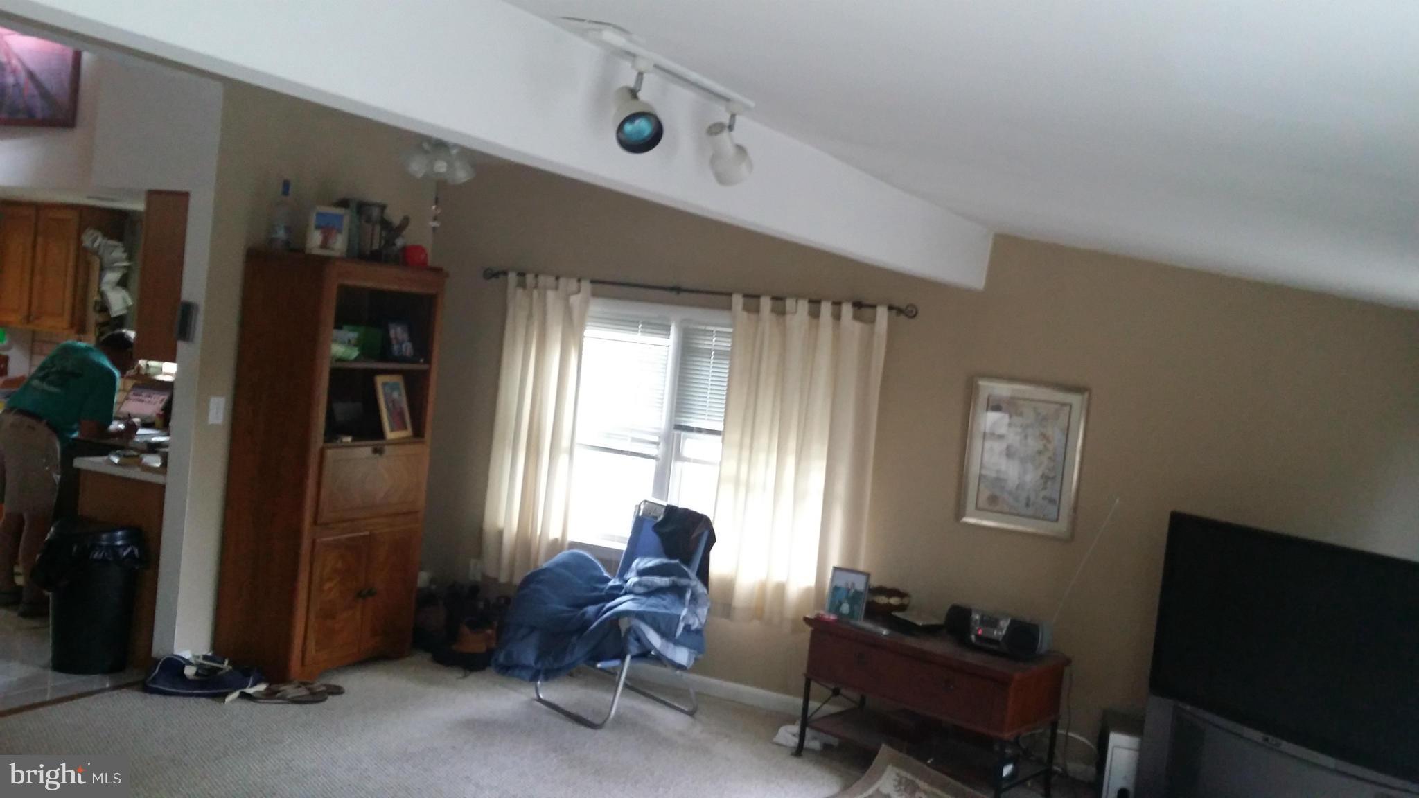 1607 Oldtown Road Edgewater, MD 21037 - Photo 5 of 11 a livingroom with workspace and a window
