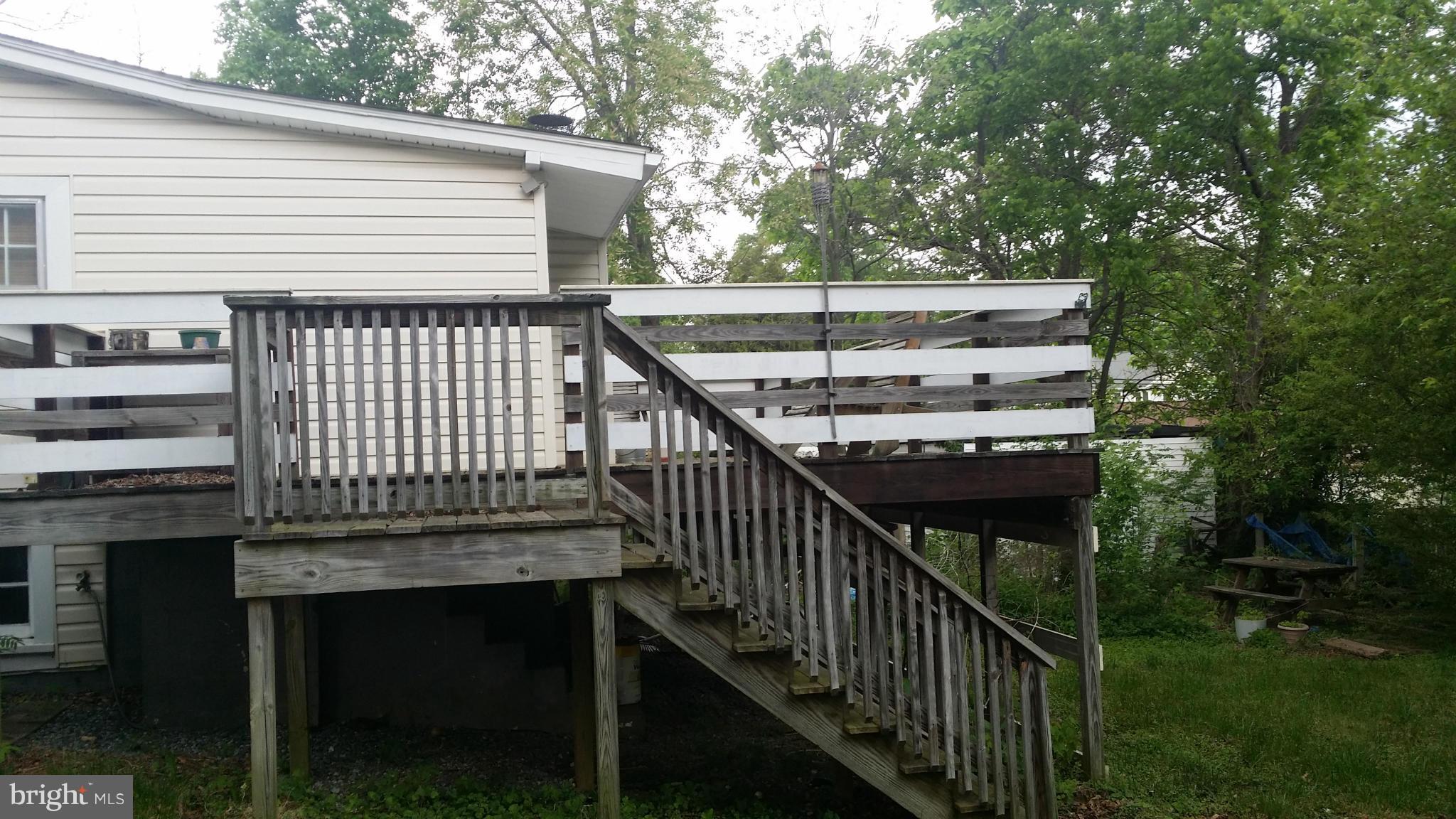 1607 Oldtown Road Edgewater, MD 21037 - Photo 10 of 11 a view of a balcony with wooden floor and fence