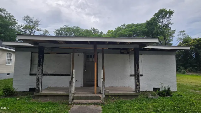a view of a small house with a large window