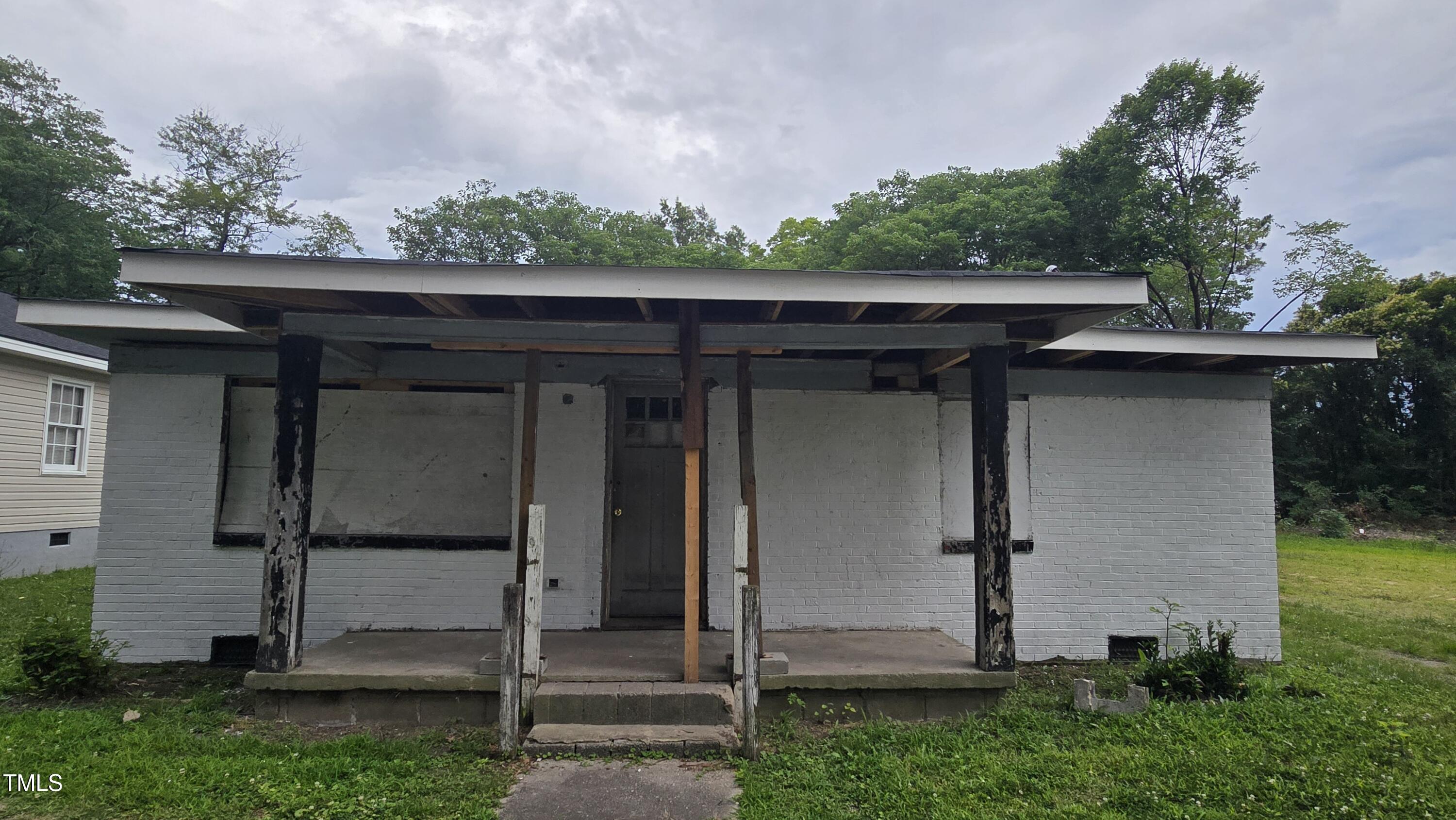 a view of a small house with a large window