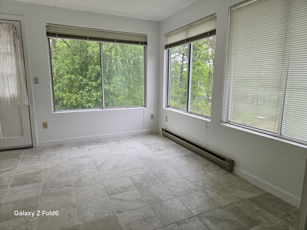 222 Buck Island Road, Unit 45 Yarmouth, MA 02673 - Photo 9 of 23 a view of an empty room with a window