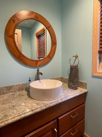 a bathroom with a sink and a mirror