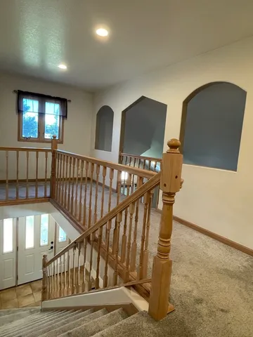 a view of entryway with wooden floor
