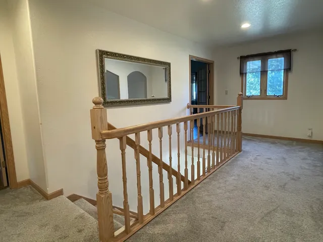 a view of a hallway with windows