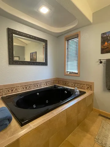 a kitchen with a sink a stove and a microwave