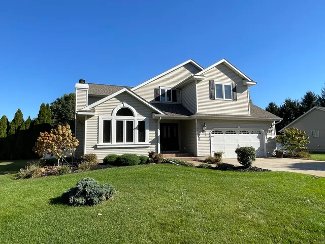 a view of a house with a yard