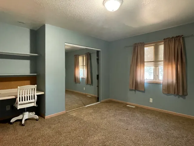 an empty room with windows