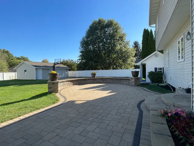 a view of a swimming pool with a yard