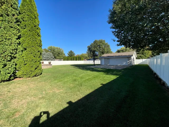 a view of a garage with a table and chairs