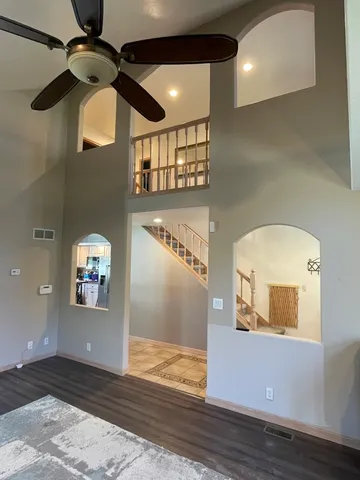 a view of entryway and hall with wooden floor