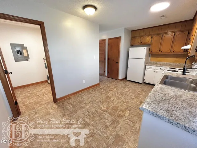a view of a kitchen with a sink