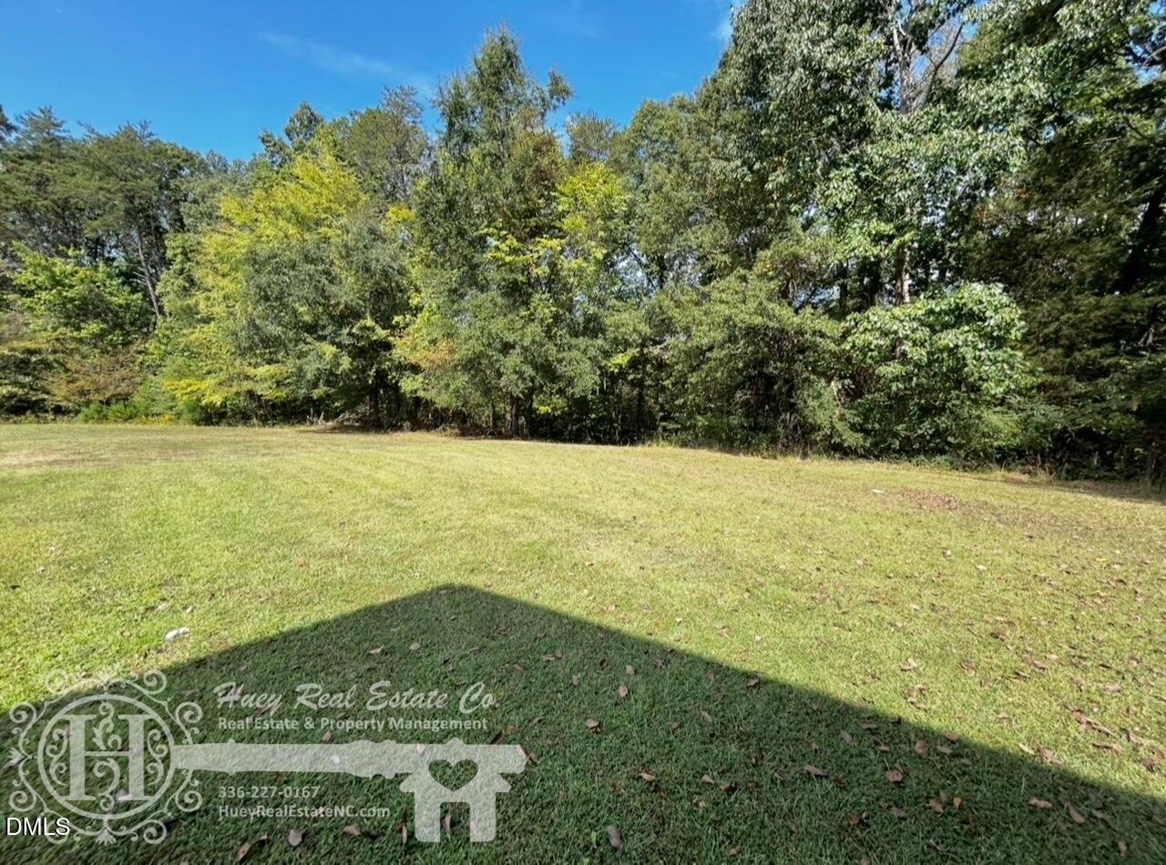 296 Seventh Avenue, Unit 3 Yanceyville, NC 27379 - Photo 3 of 21 a view of an ocean and a yard