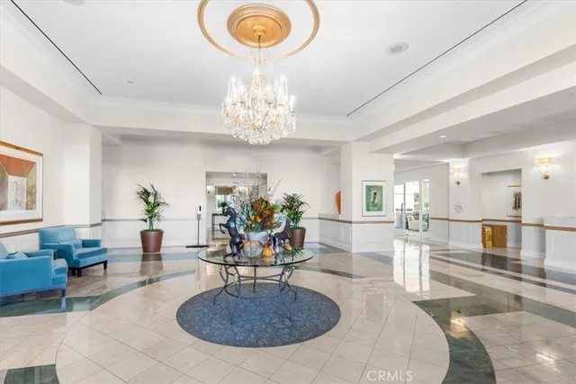 a living room with fireplace furniture and a chandelier
