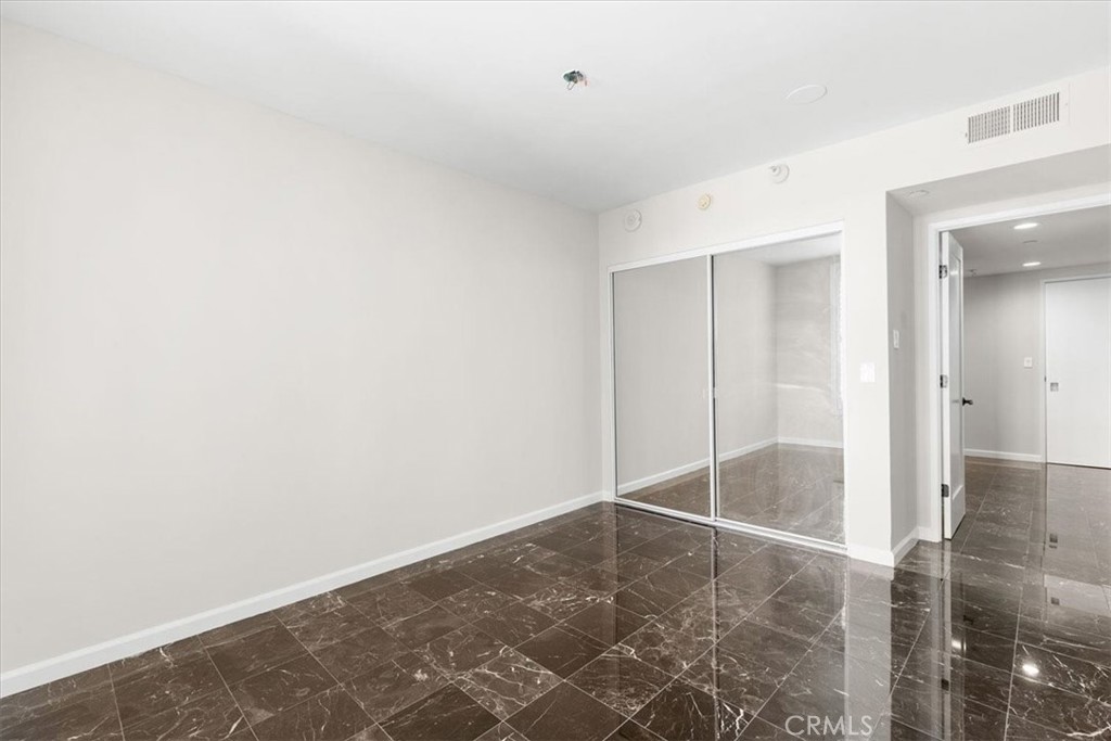 850 East Ocean Boulevard, Unit 209 Long Beach, CA 90802 - Photo 10 of 15 an empty room with wooden floor