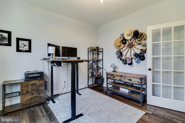 a view of a livingroom with furniture and a flat screen tv