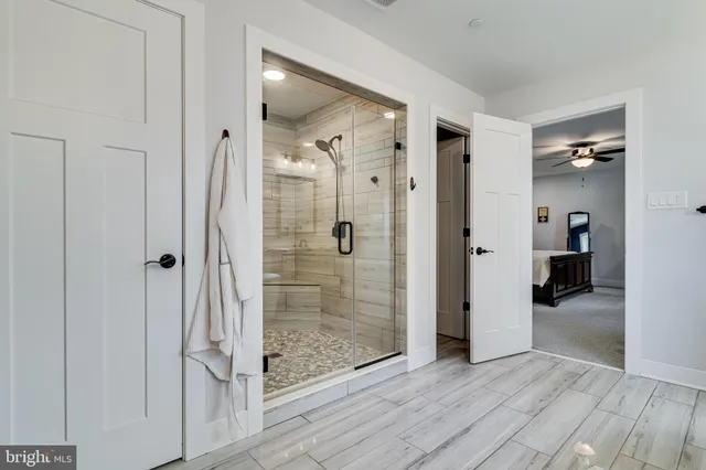 a bathroom with a shower and a sink
