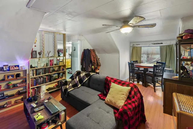 a kitchen with a refrigerator and a stove top oven