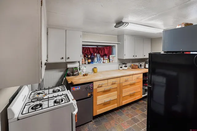 a view of a workspace with furniture and toys