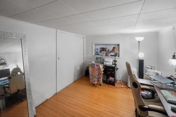 a bathroom with a sink vanity mirror and toilet