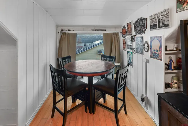 a view of a livingroom with furniture and a flat screen tv