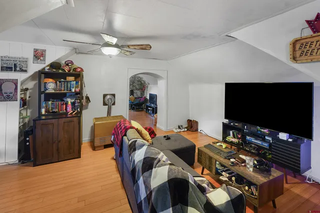 a bedroom with bed and a chair