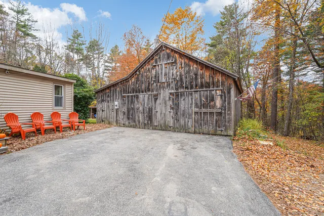 a view of a house with wooden fence