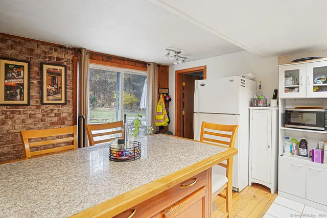 a kitchen with refrigerator and stove
