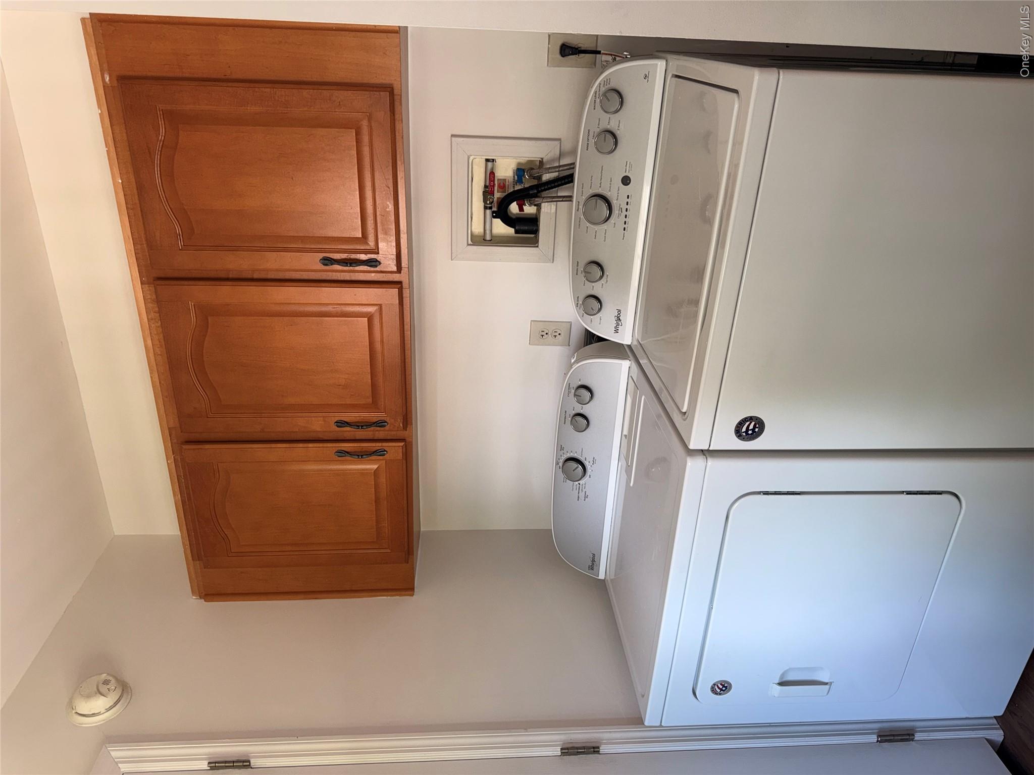 1661 Old Country Road, Unit 516 Riverhead, NY 11901 - Photo 22 of 50 a utility room with dryer and washer