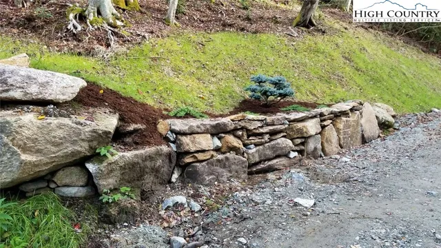 an aerial view of a house with a garden