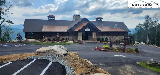 a view of a patio with table and chairs potted plants