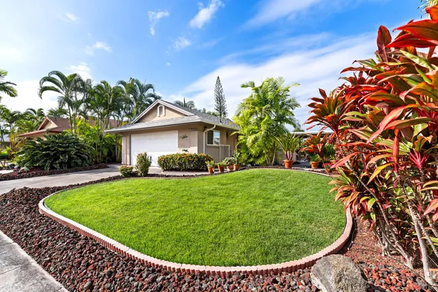 a view of a swimming pool with a yard