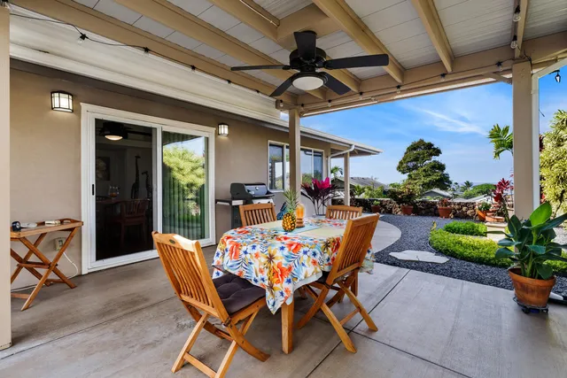 a view of a livingroom with wooden floor and a window