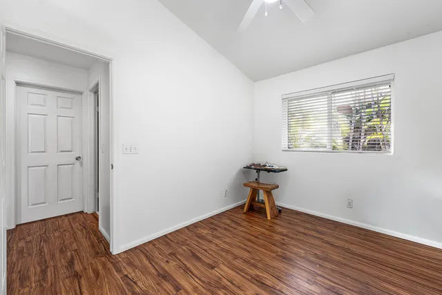 a bathroom with a sink mirror and toilet