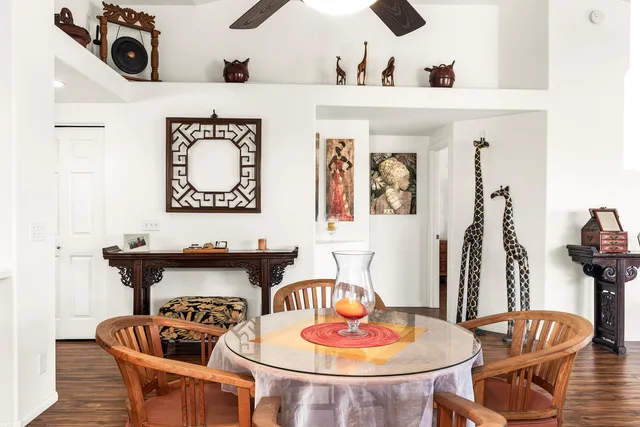 a kitchen with a table and chairs in it