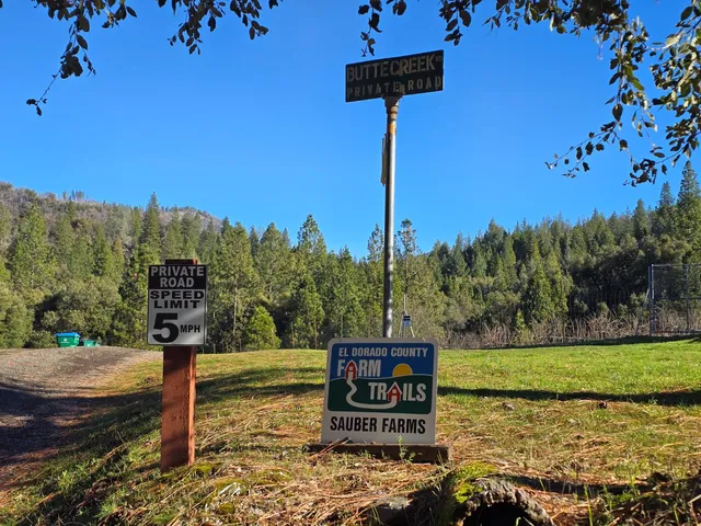 a sign board on the side of a road