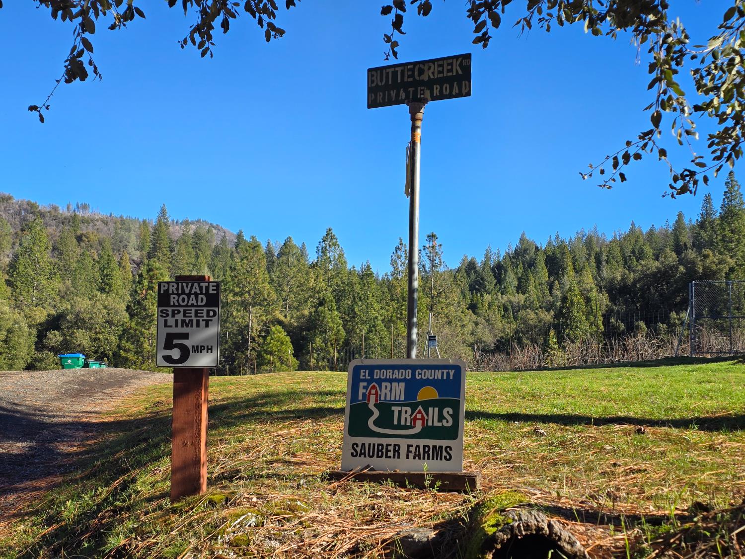 a sign board on the side of a road