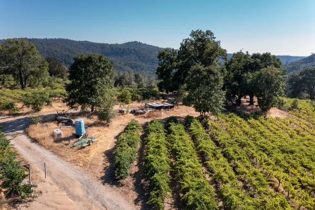 a view of swimming pool patio outdoor seating yard and mountain view