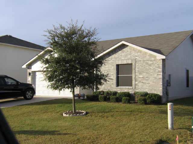 206 Rinehardt Street Hutto, TX 78634 - Photo 1 of 1 a front view of a house with garden