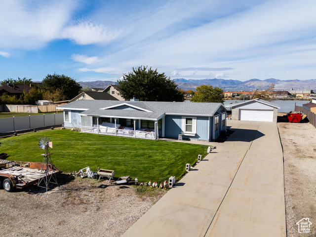 12958 South 300 East Draper, UT 84020 - Photo 1 of 38 Single story home featuring a garage, driveway, a mountain view, and roof with shingles